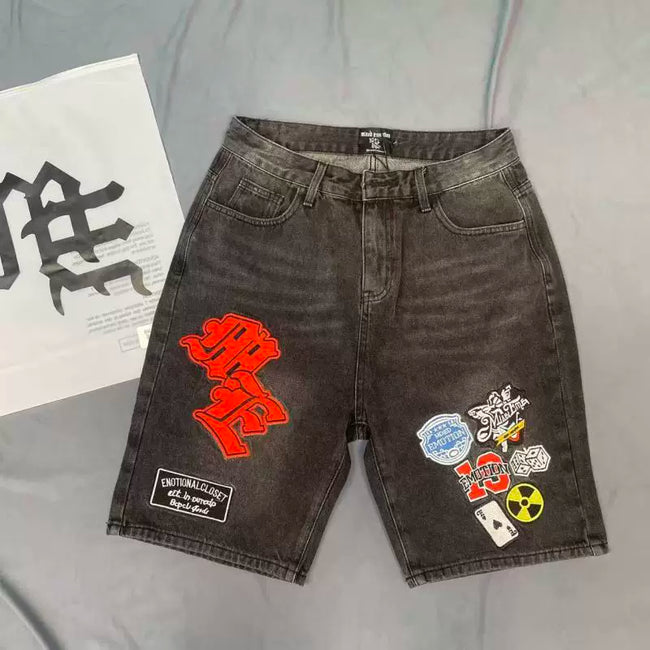 Mixed Emotion Multi‑Patch Black Denim Jorts Hover Image